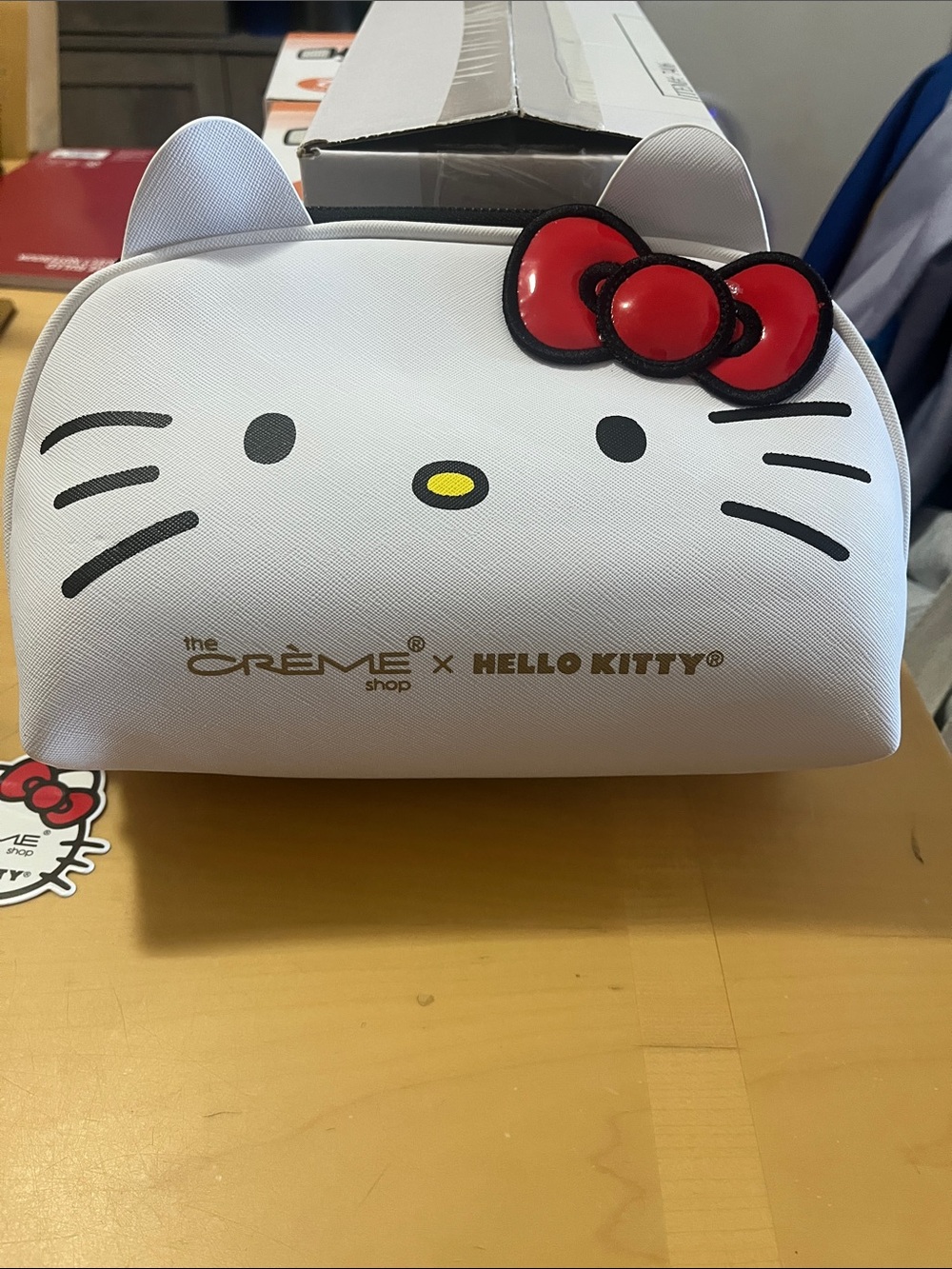 The Crème Shop x Hello Kitty White Cosmetic Pouch with Red Bow Accent